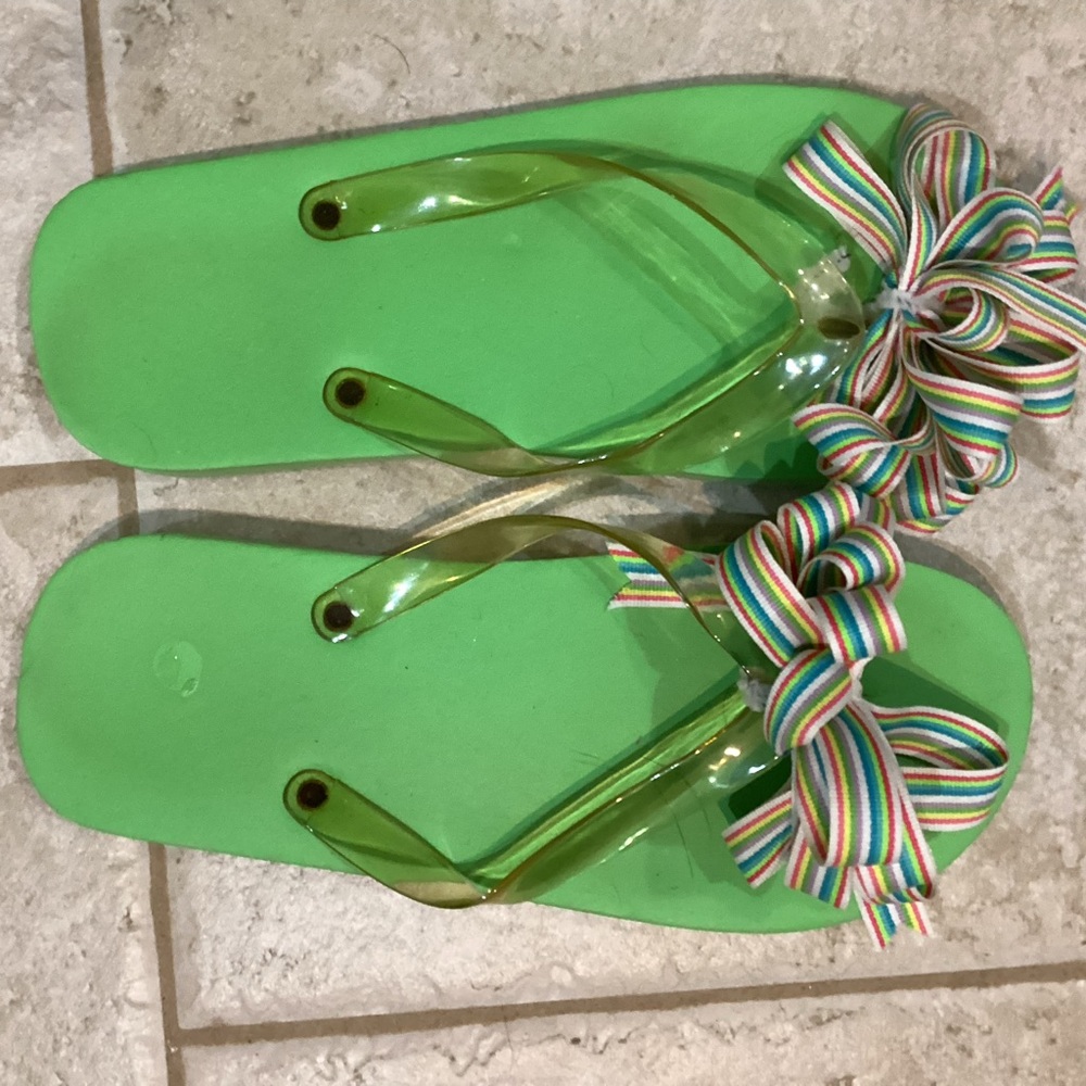 Cute flip flops. Multi colored bow. It’s still summer; get them while you can.